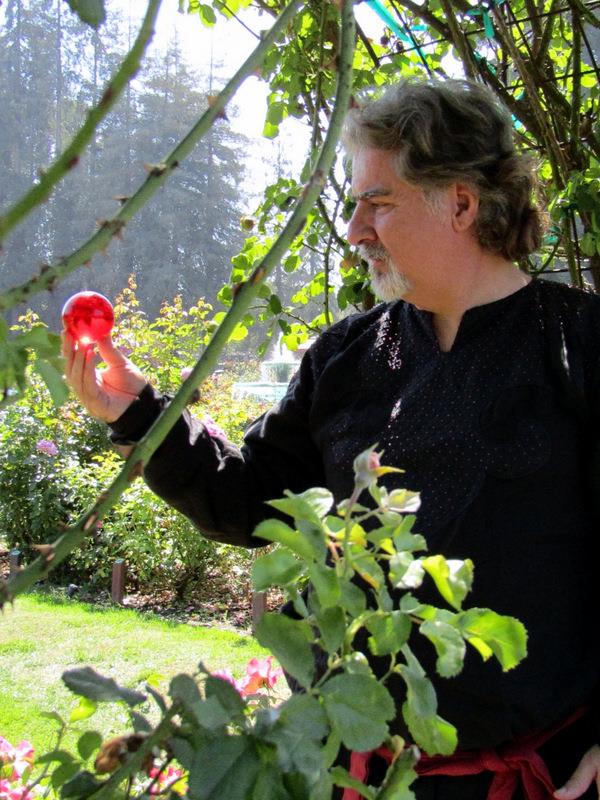 Atmospheric mentalism and fortune storytelling with red crystal sphere focus